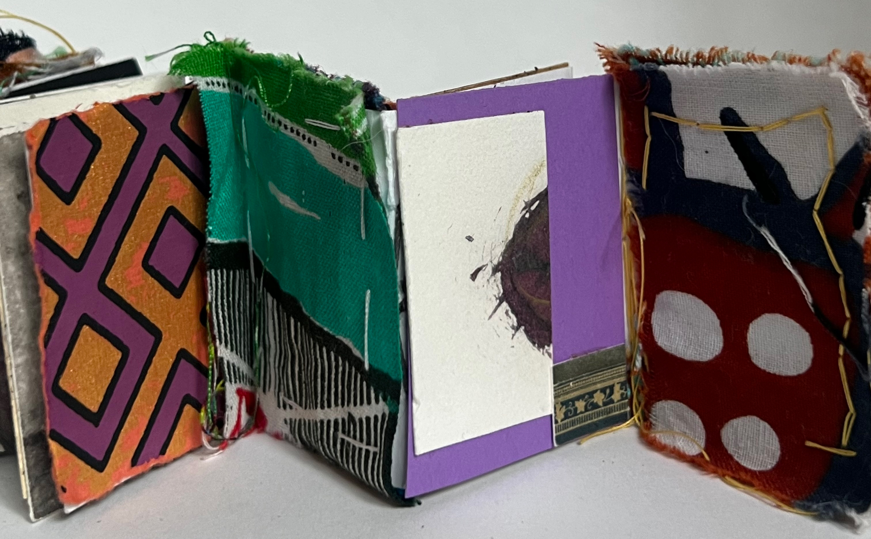 Decorated books made out of papercraft and paint