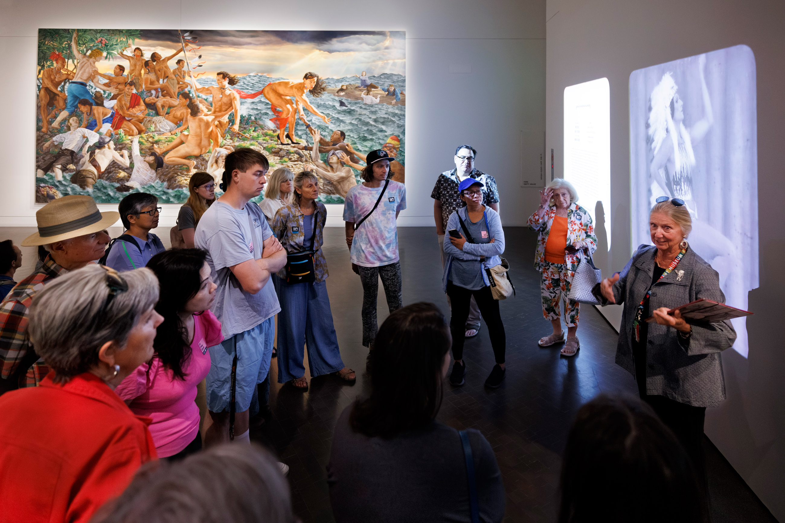 Woman giving a tour to a large group of visitors