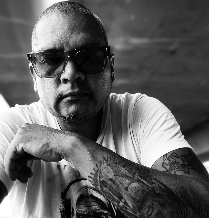 Black and white heashot of Benjamin L. West wearing sunglasses