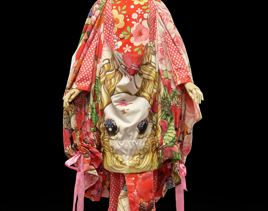 Japanese coat dress with bright designs resembling a face and floral patterns