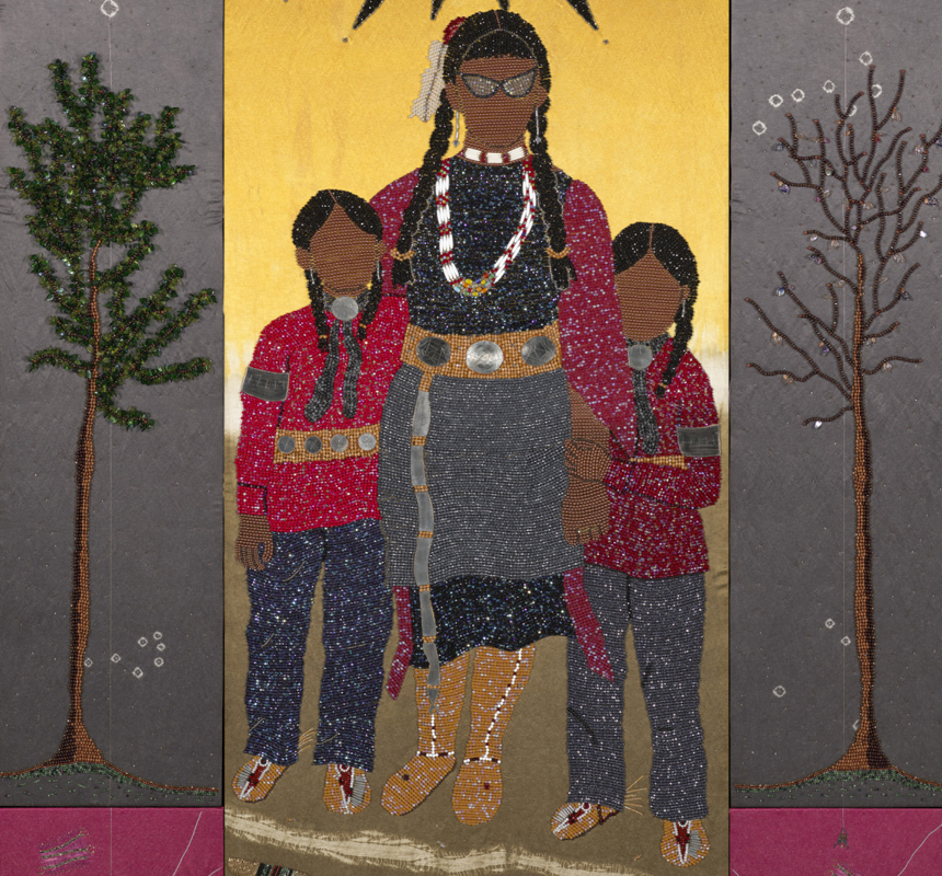 Native American woman posing with her two young boys