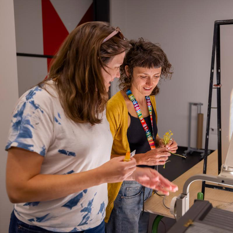 Teacher and student in an art class studio setting