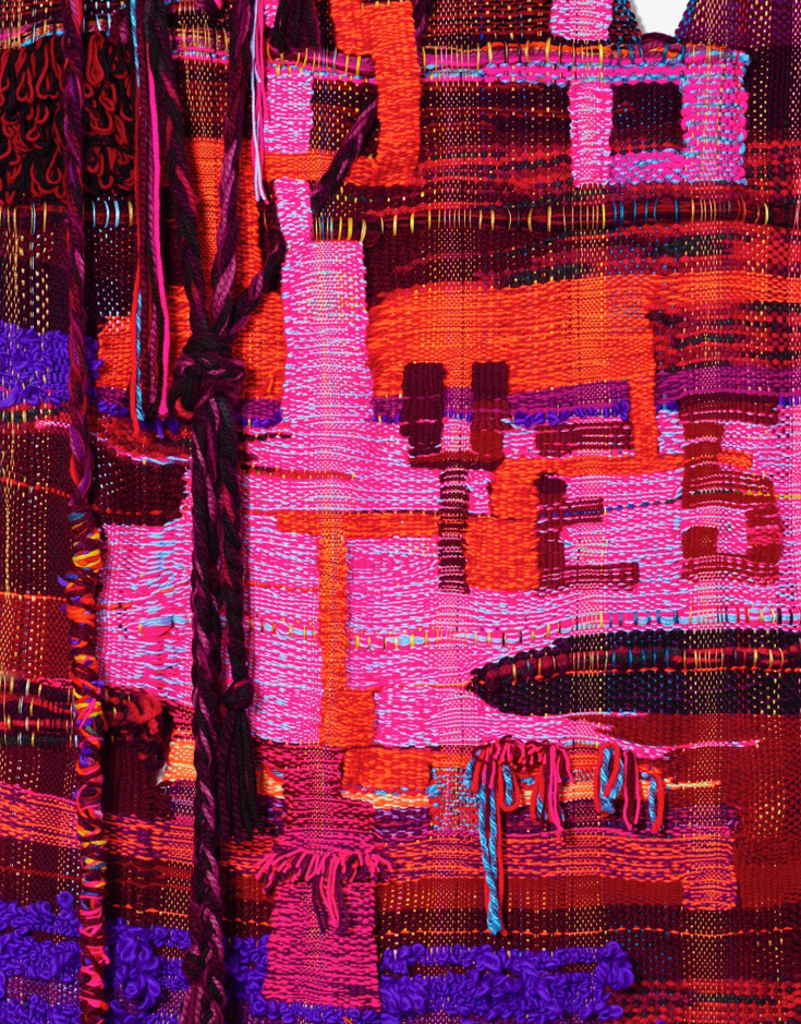 Bright fluorescent pink, red, and purple textile