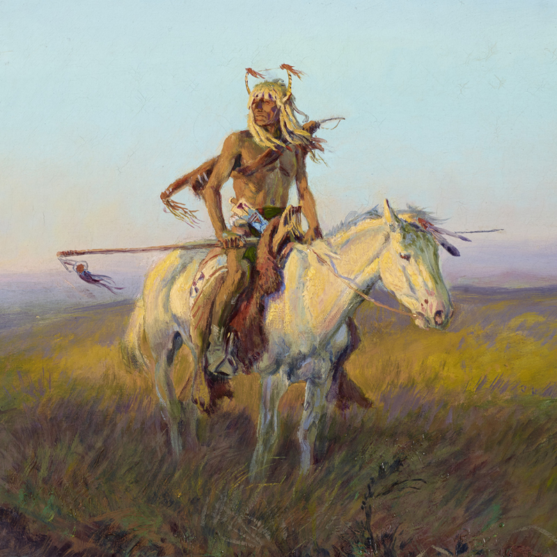 Lone Native American rider on a white horse on the plains