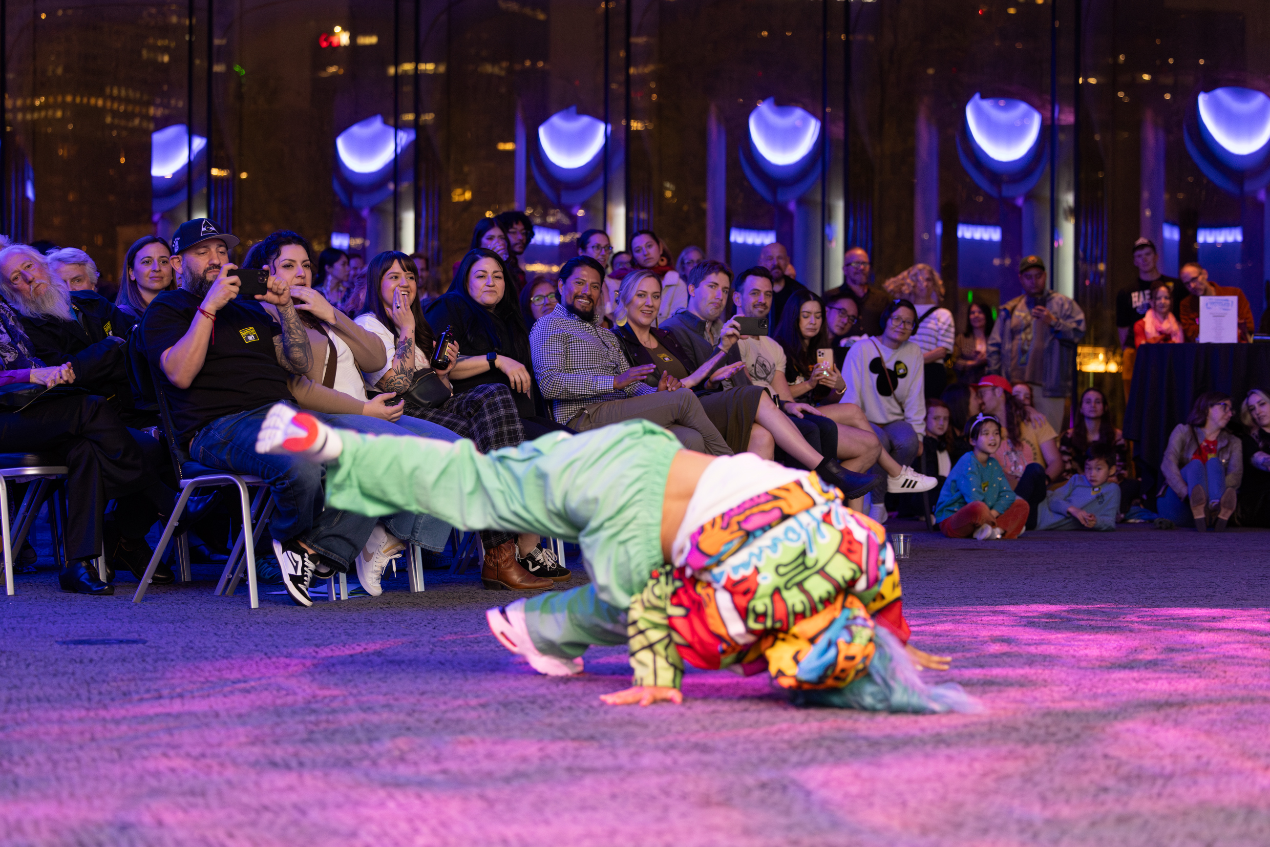 Break dancer performing in front of an audience at a previous Untitled Artist Takeover