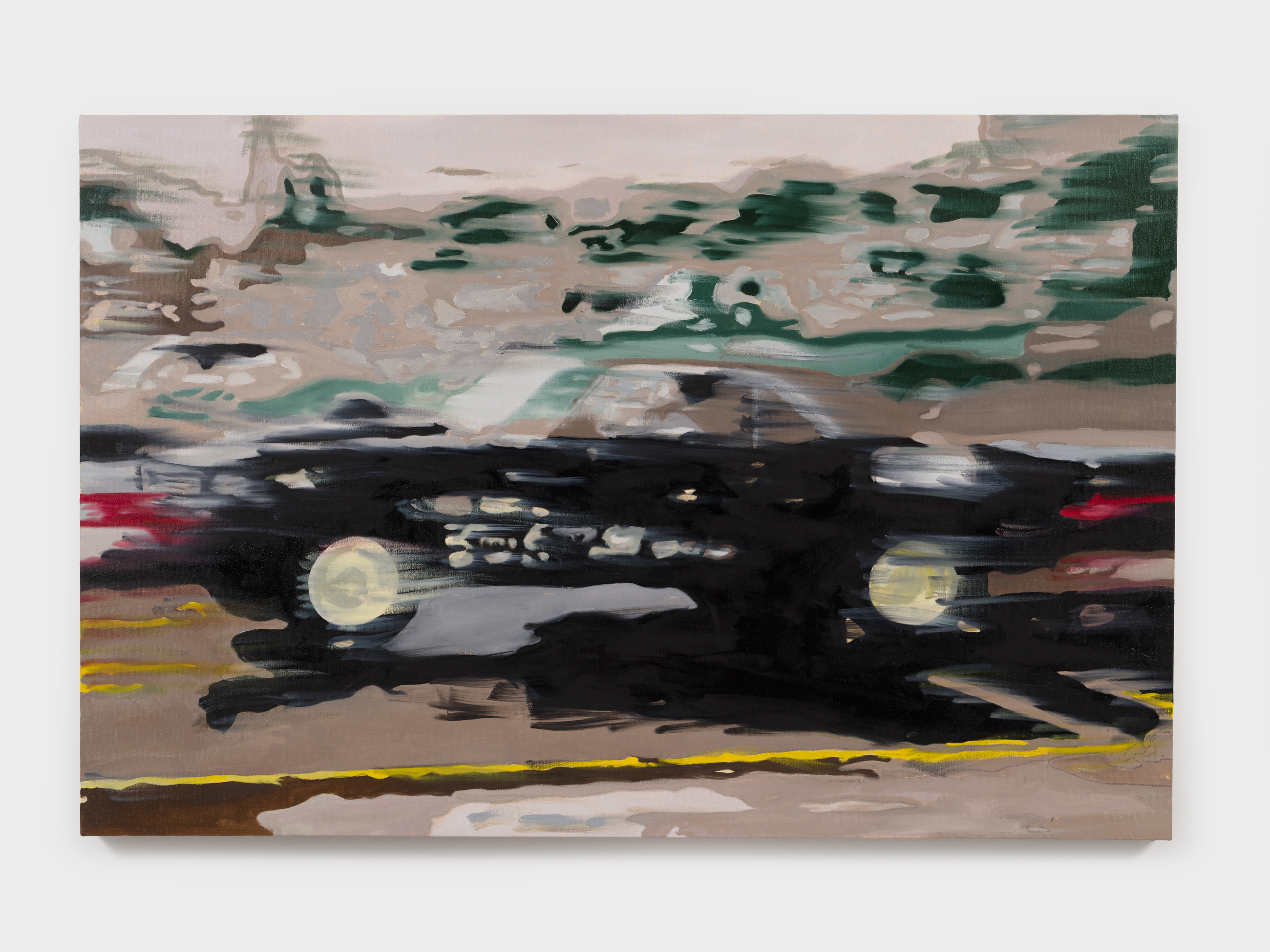 Side view of an artful, slightly out of focus car driving at high speed