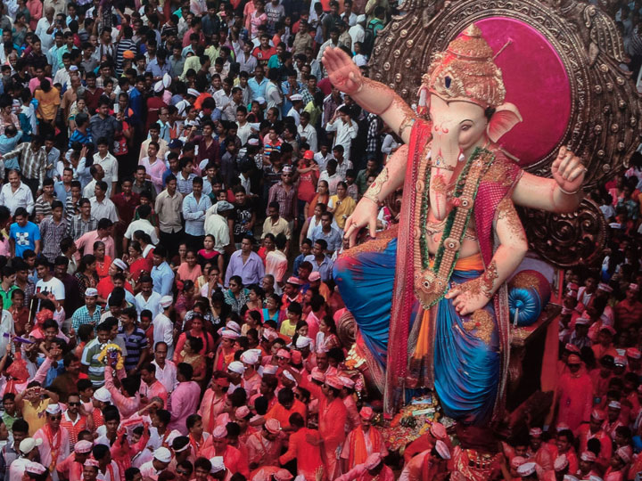 photo of a crowd and a giant Ganesha statue at Ganesha Chaturthi Festival in Mumbai