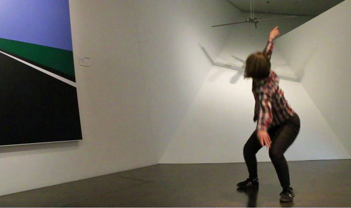 Laura Ann Samuelson dancing in a gallery at the museum