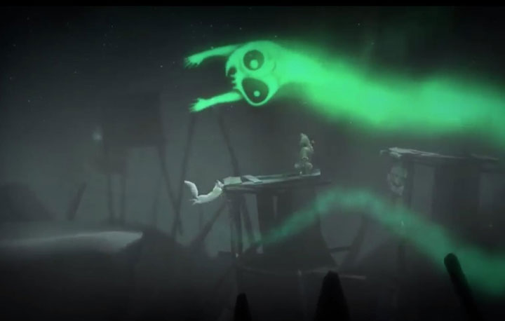 Still image from the video game Never Alone that shows the artic fox and the young girl Nuna