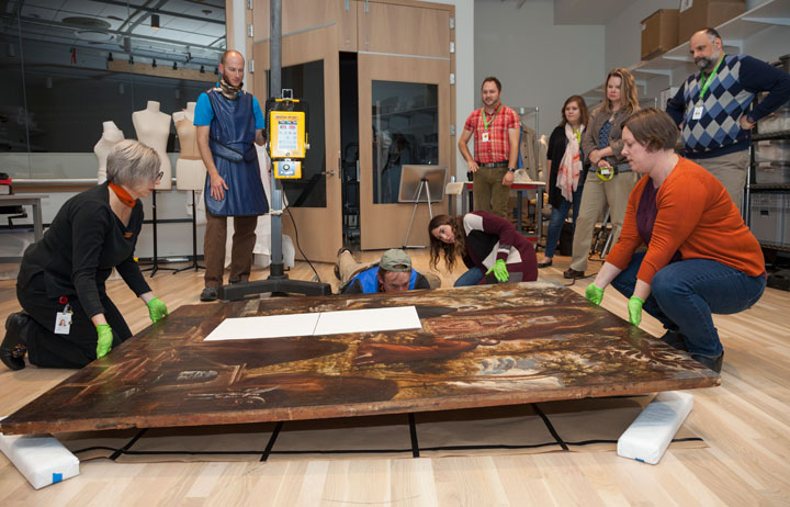Conservators position a painting to be x-rayed