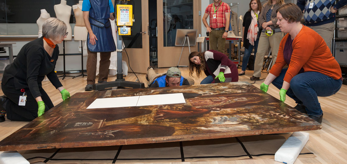 Conservators position a painting to be x-rayed