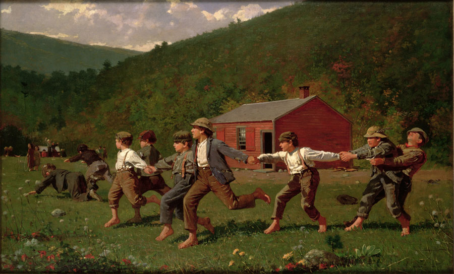 Barefoot boys playing snap the whip in front of a red building