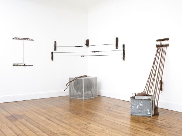 Mixed media installation against white wall backdrop