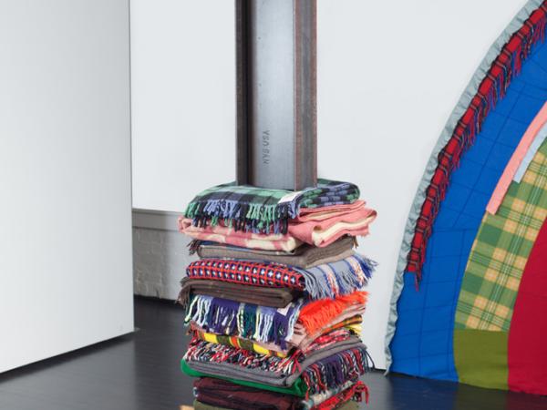 Colorful patterned blankets stacked like a tower