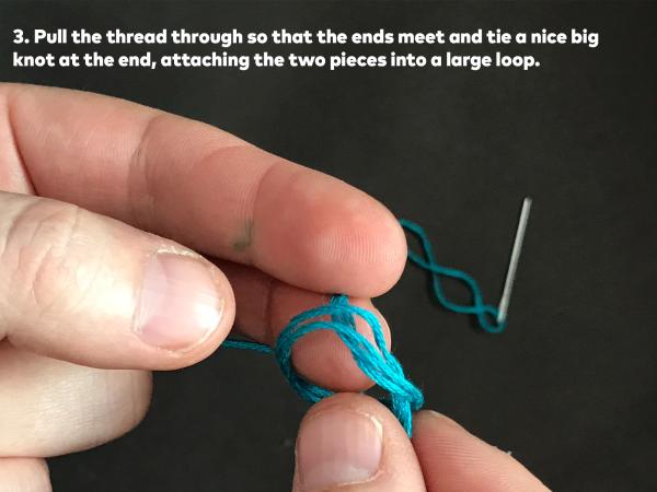 Step 3. Pull the thread through so that the ends meet and tie a nice big knot at the end, attaching the two pieces into a large loop. 