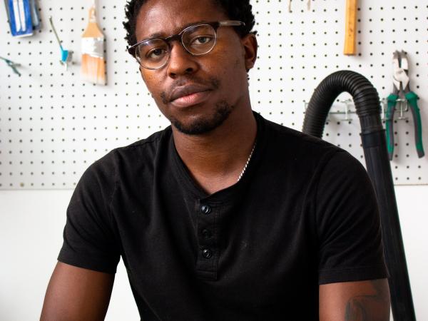 Portrait of the artist Simphiwe Ndzube at his studio