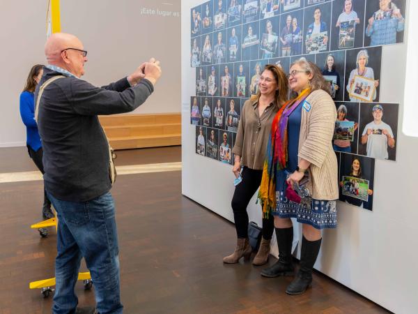 Two women posing for a photo taken by another visitor