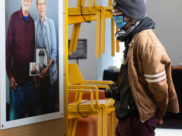 Young man looking at photograph