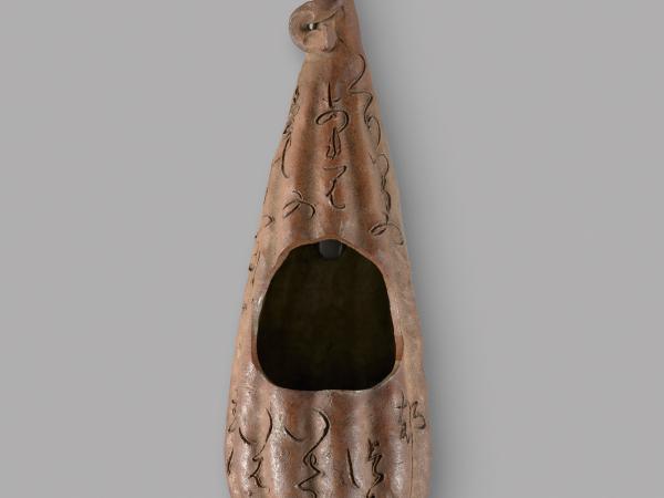 Stoneware sculpture with a hole carved out in the middle