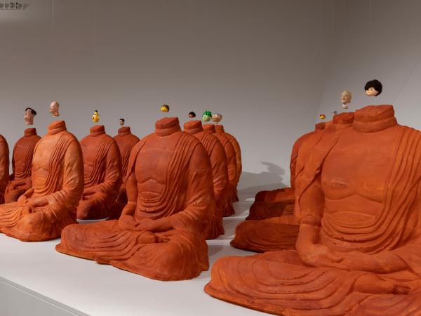 'Headless' by Michael Joo, features headless Buddhas with pop culture icon's heads dangling above them. 