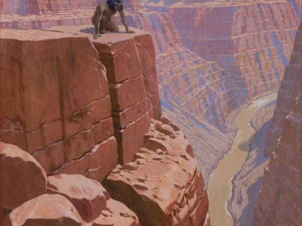 Native American man crouching on the side of a cliff in the red Grand Canyons