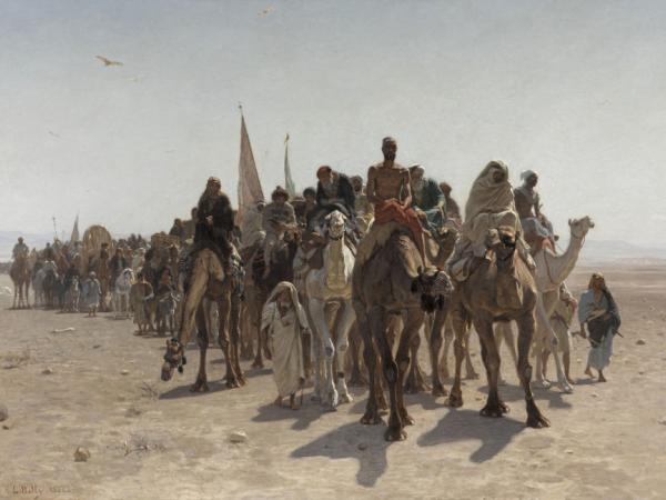 Group of men and women camels and foot trekking through the desert to Mecca.