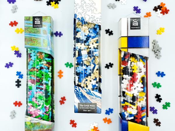 containers of colorful wooden blocks similar to puzzle pieces