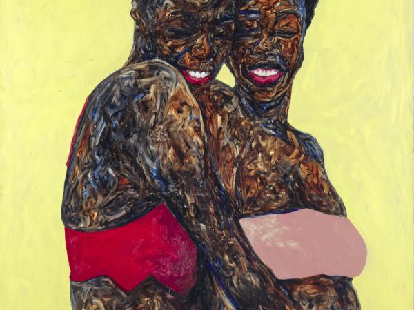 Two Black woman embracing and laughing