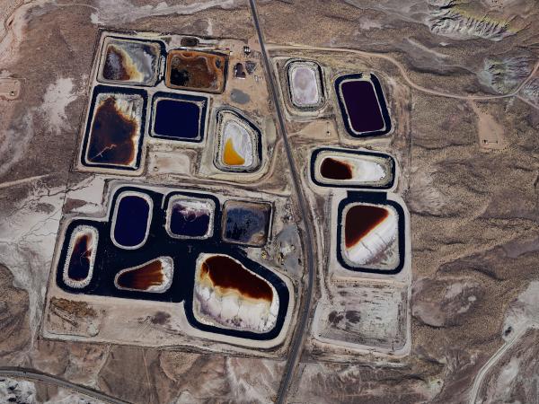 Overhead view of an oil and gas field with pockets of minerals and materials that resemble lakes
