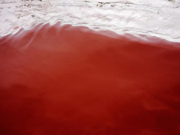 Photograph of the great salt lake with a large swath of red sand