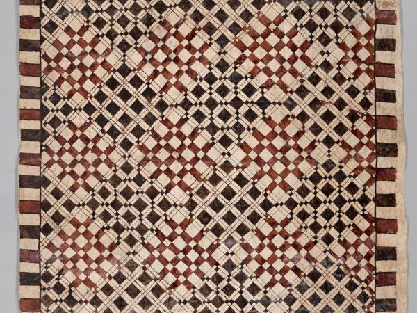 Large textile with repeating square patterns of black and dark red