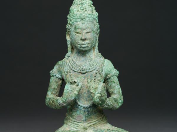 Seated bronze religious figure