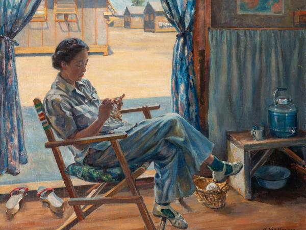 Japanese woman sitting and knitting in a rocking chair