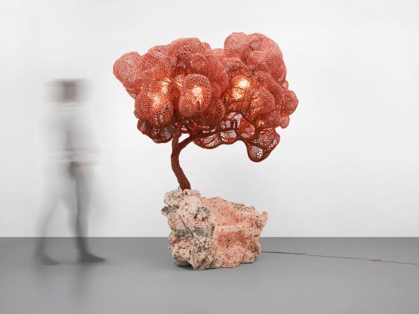 Chair designed to look like a tree on a rock