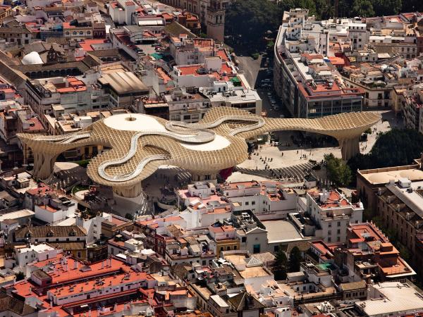 Aerial view of a snake-like structure in a bustling Spain city