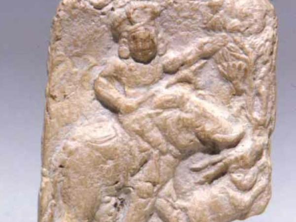 Terracotta stone plaque featuring a figure from West Bengal
