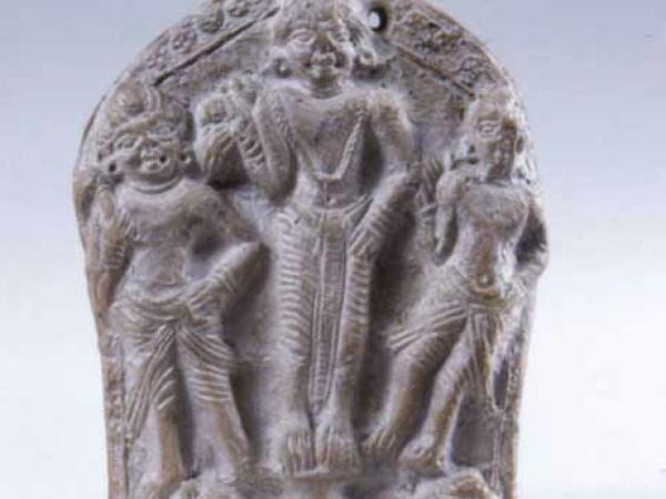 Plaque of three Indian figures etched into stone