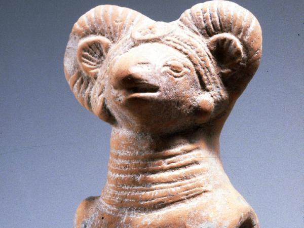 Cart toy in the shape of a ram with horns