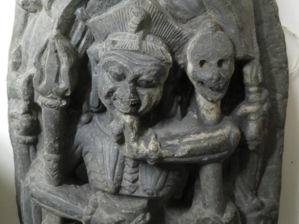 Stone rounded carving of Indian royal figures