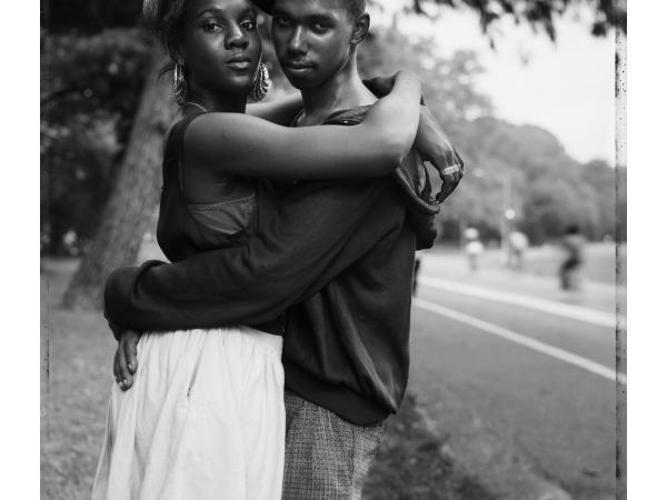 A young black couple embracing