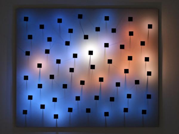 Abstract painting with black patterned boxes and blue and red lighting