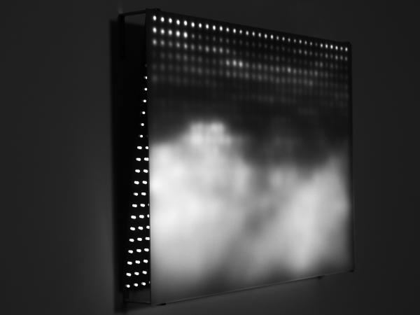 Black and white installation with cloudy, hazed-out white image