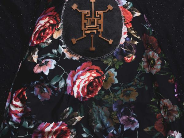 Floral pattern surrounding a symbol