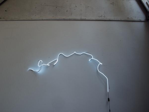 Wall featuring a squiggly light installation