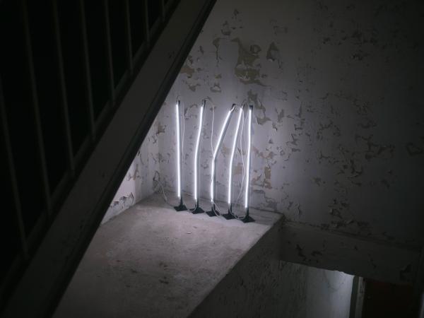 Five vertical lights in a wall installation