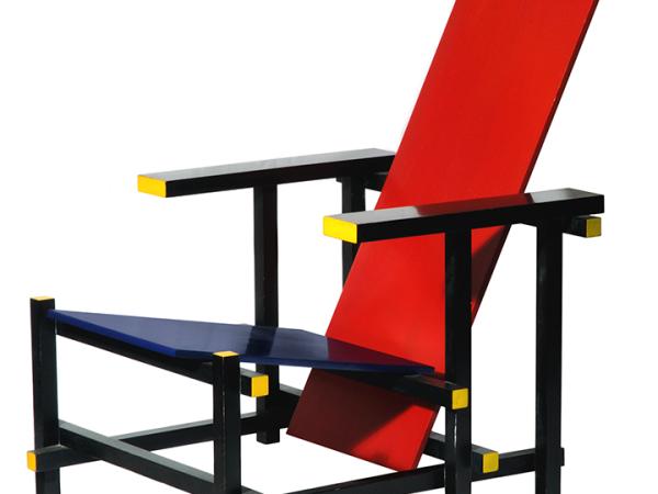 Low wooden chair with a red back and black base