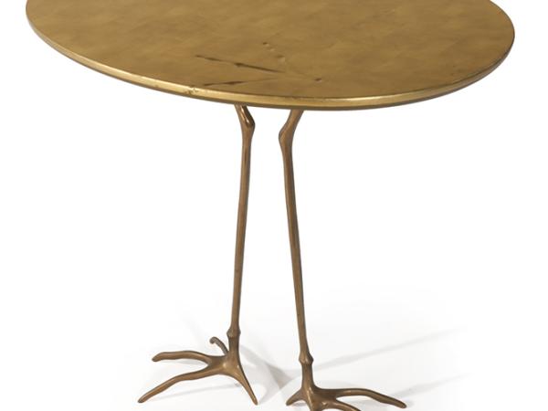 Wooden tabble with bird-like claw feet