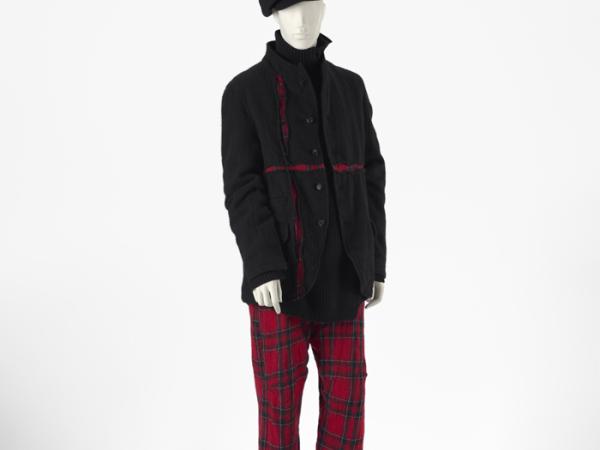 Male ensemble with a black jacket and red gingham pants