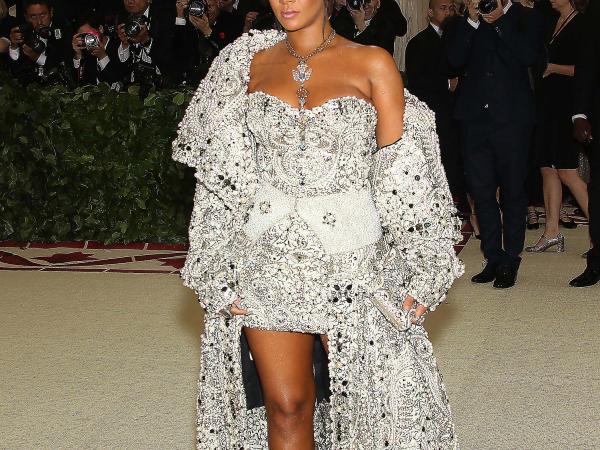 Rihanna wearing a white sparkling costume resembling a pope's cassock