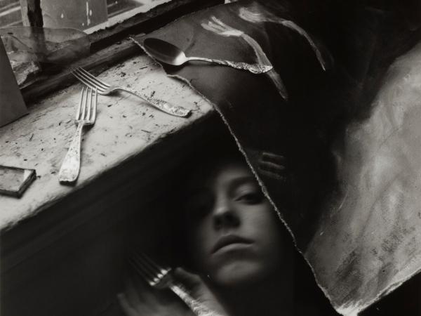 Woman surrounded by forks